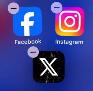 Image of Facebook, Instagram, and X (Twitter) being removed from a smartphone.