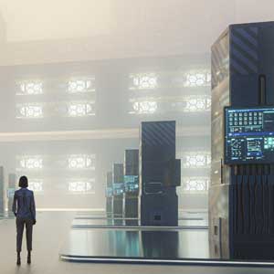 Image of a person standing before an array of large computers.